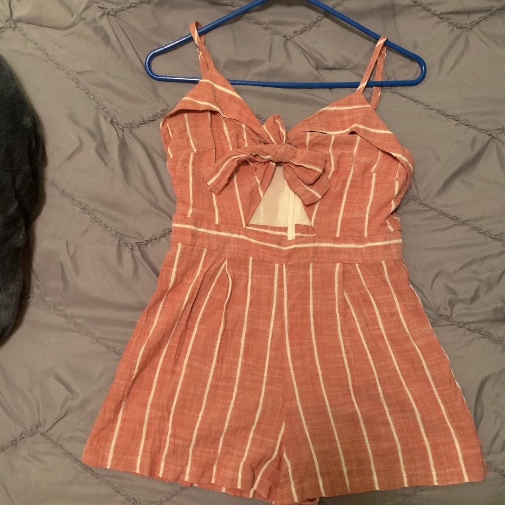 Red and white shorts romper.